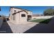 Artificial grass lawn, pavers, and exterior view of this beautiful home at 17441 W Rock Ledge Rd, Goodyear, AZ 85338