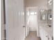 This bathroom features a double vanity, tiled floors and tub/shower with a glass enclosure at 17441 W Rock Ledge Rd, Goodyear, AZ 85338