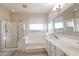 Relaxing bathroom with shower, soaking tub, and double vanity with great lighting at 17441 W Rock Ledge Rd, Goodyear, AZ 85338