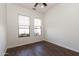 Well-lit room with a ceiling fan, a large window and beautiful flooring at 17441 W Rock Ledge Rd, Goodyear, AZ 85338