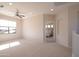 Upstairs room leads to the main bedroom with a view of the manicured yard at 17441 W Rock Ledge Rd, Goodyear, AZ 85338