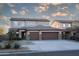 Spacious two-story home with a three-car garage and well-manicured front yard at 17441 W Rock Ledge Rd, Goodyear, AZ 85338