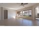 Bright and airy living room with tile floors, large windows, and recessed lighting at 17441 W Rock Ledge Rd, Goodyear, AZ 85338