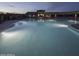 Inviting community pool and lounge area perfect for relaxation under the evening sky at 17441 W Rock Ledge Rd, Goodyear, AZ 85338