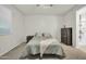 Serene bedroom offers neutral tones, plush carpeting, and ample natural light through a large window at 17634 W Via De Luna Dr, Surprise, AZ 85387