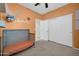 Bright bedroom showcasing a crib and a closet with sliding doors at 17634 W Via De Luna Dr, Surprise, AZ 85387