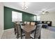 Inviting dining room features a large table, chairs and blends into the open-concept living area at 17634 W Via De Luna Dr, Surprise, AZ 85387