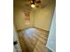 This bedroom features wood-look floors, a ceiling fan, and a window with wood-slat blinds at 18391 W Stinson Dr, Surprise, AZ 85374