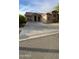 Charming single-story home with desert landscaping, concrete driveway, and inviting curb appeal at 18391 W Stinson Dr, Surprise, AZ 85374