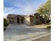 Charming single-story home with desert landscaping, concrete driveway, and inviting curb appeal at 18391 W Stinson Dr, Surprise, AZ 85374