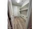 This laundry room has a tile floor, shelving, and hookups for a washer and dryer at 18391 W Stinson Dr, Surprise, AZ 85374