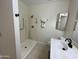 Clean bathroom with a walk-in shower, white vanity, and modern fixtures at 18841 N Palomar Dr, Sun City West, AZ 85375