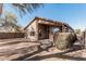 Backyard featuring a neutral colored home exterior, privacy block wall fence, and desert landscaping at 1903 E San Tan St, Chandler, AZ 85225