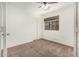 Bedroom featuring a ceiling fan, large window, and neutral carpet at 1903 E San Tan St, Chandler, AZ 85225