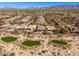 Panoramic aerial shot capturing stunning desert homes near a golf course in Scottsdale, Arizona at 19460 N 84Th St, Scottsdale, AZ 85255