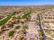 Breathtaking aerial capture of golf course homes in desert landscape, promising luxury and relaxation in Scottsdale at 19460 N 84Th St, Scottsdale, AZ 85255