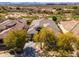 Overhead shot showcases a beautiful home with a tile roof and desert landscaping at 19460 N 84Th St, Scottsdale, AZ 85255