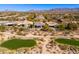 Scenic aerial view of desert homes with lush golf course and mountain backdrop in Scottsdale, Arizona at 19460 N 84Th St, Scottsdale, AZ 85255