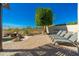 An inviting backyard features a pool, patio, built-in BBQ, and desert views at 19460 N 84Th St, Scottsdale, AZ 85255