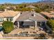 Tranquil backyard retreat with a shaded patio, a cozy water feature and desert landscaping at 19460 N 84Th St, Scottsdale, AZ 85255