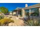 A relaxing backyard with a fire pit, lounge chairs, and a beautiful desert view at 19460 N 84Th St, Scottsdale, AZ 85255