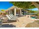 Lounge chairs near a pool, and a covered patio create a perfect outdoor living space at 19460 N 84Th St, Scottsdale, AZ 85255