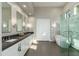 Bright bathroom featuring a double vanity, marble accents, and a luxurious stand-alone bathtub at 19460 N 84Th St, Scottsdale, AZ 85255