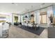 Stylish dining area with modern lighting, seating for six, and a seamless flow to the living spaces at 19460 N 84Th St, Scottsdale, AZ 85255