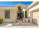 Inviting front entrance with modern lighting, desert landscaping, and a well-maintained walkway at 19460 N 84Th St, Scottsdale, AZ 85255