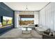 Bright living room showcases a modern chandelier, a plush sectional, and sliding glass doors to outside at 19460 N 84Th St, Scottsdale, AZ 85255