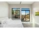 This main bedroom features beautiful backyard views from two large windows and a ceiling fan at 19460 N 84Th St, Scottsdale, AZ 85255