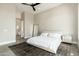 Modern main bedroom featuring a ceiling fan, a decorative rug and a bathroom access at 19460 N 84Th St, Scottsdale, AZ 85255