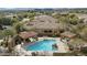 Stunning aerial view of a backyard pool and spa with covered patio areas at 19460 N 84Th St, Scottsdale, AZ 85255