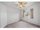 Carpeted bedroom with a ceiling fan, vaulted ceiling, and natural light from the window at 20914 N 39Th Way, Phoenix, AZ 85050