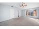 Spacious carpeted bedroom with high ceilings and natural light from the large window at 20914 N 39Th Way, Phoenix, AZ 85050