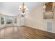 Bright living room features hardwood floors, neutral paint, and several large windows at 20914 N 39Th Way, Phoenix, AZ 85050