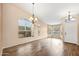 Bright living room features hardwood floors, neutral paint, and several large windows at 20914 N 39Th Way, Phoenix, AZ 85050