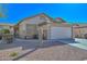 Inviting single-story home with low-maintenance desert landscaping and attached two car garage at 21511 N 79Th Dr, Peoria, AZ 85382