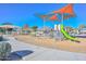 Neighborhood playground with multiple play structures and shaded seating areas at 21511 N 79Th Dr, Peoria, AZ 85382