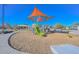 Shaded community playground area with slides, climbing structures, and recreation equipment at 21511 N 79Th Dr, Peoria, AZ 85382