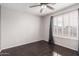 Bedroom featuring shuttered windows and a ceiling fan at 21732 N 86Th Ln, Peoria, AZ 85382