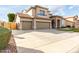 Charming two-story home with a three car garage and desert landscaping at 21732 N 86Th Ln, Peoria, AZ 85382