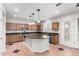 Spacious kitchen featuring a center island, stainless steel appliances, and light wood cabinetry at 21732 N 86Th Ln, Peoria, AZ 85382