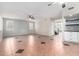 Spacious living room showcasing tile flooring and multiple ceiling fans at 21732 N 86Th Ln, Peoria, AZ 85382