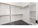 Walk-in closet featuring built-in shelving and ample hanging space at 21732 N 86Th Ln, Peoria, AZ 85382