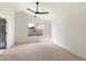 Spacious bedroom with vaulted ceiling features a ceiling fan and a window at 21824 N 32Nd Ave, Phoenix, AZ 85027