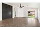 Spacious living room featuring herringbone floors, modern fixtures, white walls, and natural light at 21824 N 32Nd Ave, Phoenix, AZ 85027