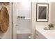 Bright bathroom featuring subway tile in shower, vanity with white countertop, and woven decor at 2195 N Peden Dr, Chandler, AZ 85225