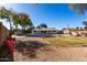 A large backyard with mature trees, a refreshing in-ground pool, and ample space for outdoor activities and entertaining at 2201 S Evergreen Rd, Tempe, AZ 85282