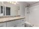 Bathroom with granite vanity, white cabinets, and a tiled shower at 2201 S Evergreen Rd, Tempe, AZ 85282